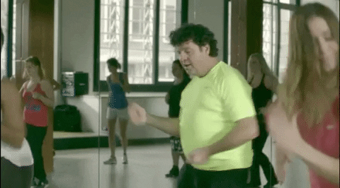 Man with wrong self-image in old age and without sense of rhythm participating in Zumba lession.